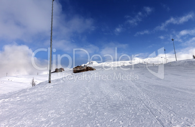 ski slope and hotels in winter mountains