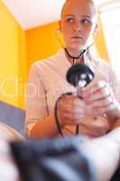 nurse with stethoscope looks at the patient