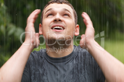 young man under the rain.