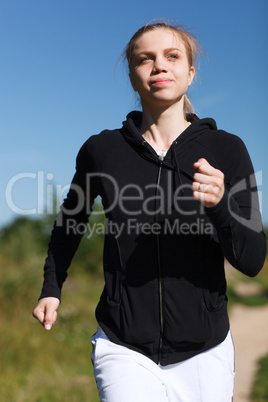 girl running in the park. close up