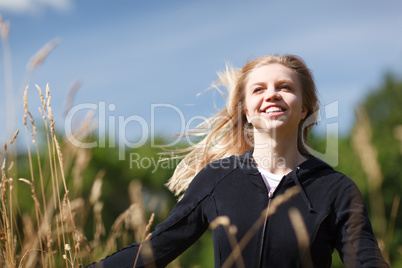young and happy girl in the field