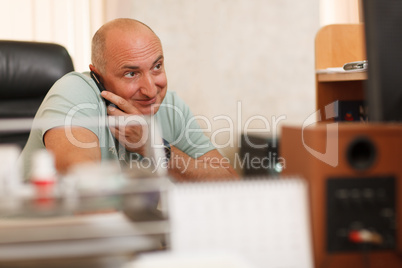 middle-aged businessman on the phone