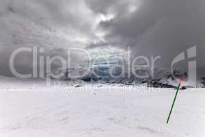 slope for slalom and sky with storm clouds