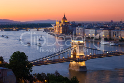 budapest cityscape sunset with chain bridge and parliament build