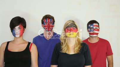 Serious people with flags on faces