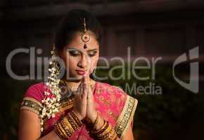 Young Indian girl praying
