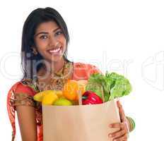 Indian woman in sari dress groceries shopping