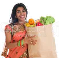 Indian woman having groceries shopping
