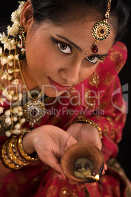 Diwali Indian female with oil lamp