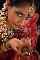 Diwali Indian female with oil lamp