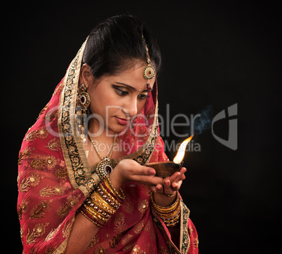Diwali Indian woman with oil lamp