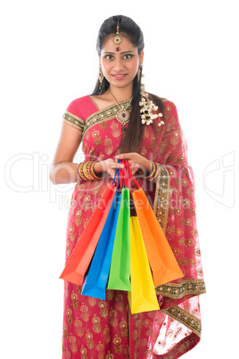 Indian woman holding shopping bags