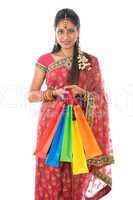 Indian woman holding shopping bags