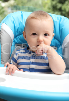 baby sitting in highchair