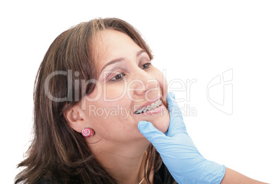 Woman checking his routine brackets on her dentist