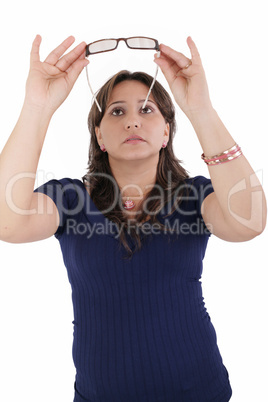 hispanic young woman checking her eyeglasses