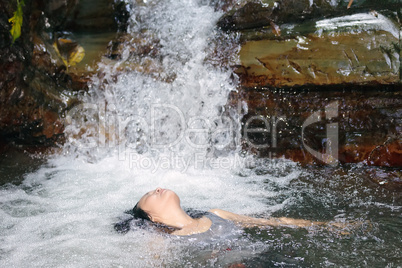 woman in waterfall