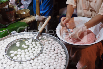 Woman preparing pork ball