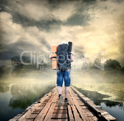 Tourist on the wooden bridge