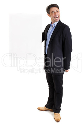 Dapper businessman with blank sign