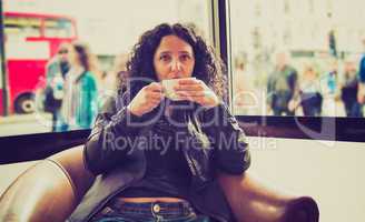 pretty brunette drinking coffee tea