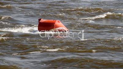 Red buoy in a river