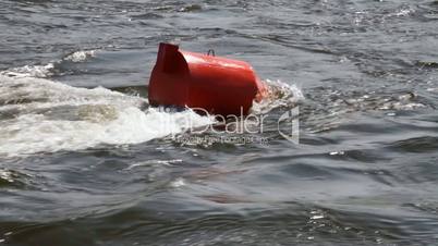 Red buoy in a river