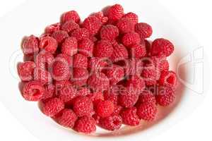Raspberries on a plate over white