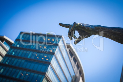 bronze statue pointing finger