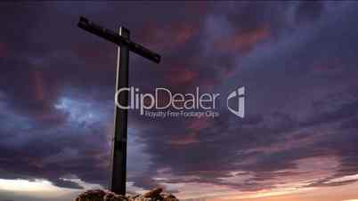 cross dramatic sky at the sunset