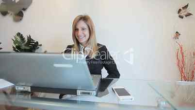 happy business woman working at her desk