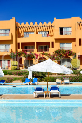 Sunbeds near swimming pool at luxury hotel, Sharm el Sheikh, Egy