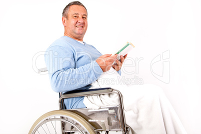 Man in wheelchair with book