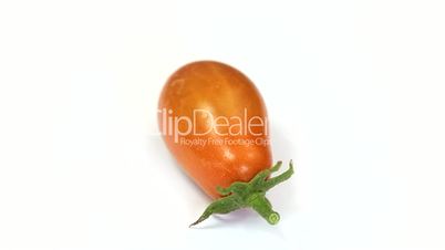 Close up of orange tomatoes rotating
