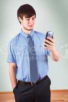 Young businessman looking at his smartphone