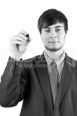Young businessman with pen on the blackboard