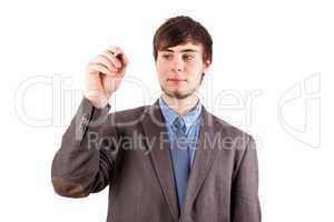 Young businessman with pen on the blackboard