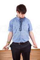 Young business man with empty pockets