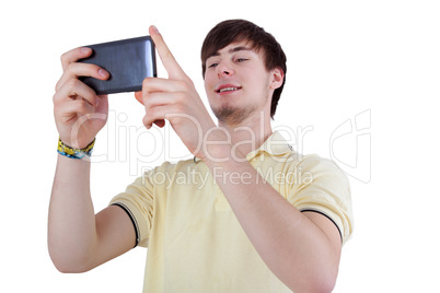 Young man with smiling eyes looking at his smartphone