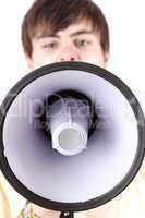 Young man shouting into the megaphone