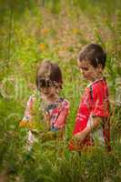boy and girl in tall grass