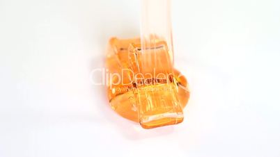 Orange fluid gel on whitebackground