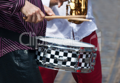 hands of a musician with a drum