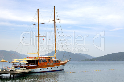 sail yacht near beach on turkish resort, marmaris, turkey