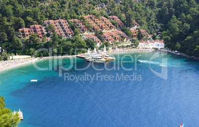 yachts at the pier and beach on turkish resort, fethiye, turkey