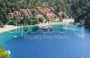 yachts at the pier and beach on turkish resort, fethiye, turkey