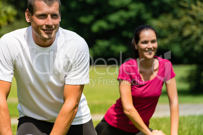 Close up portrait of couple stretching outdoors