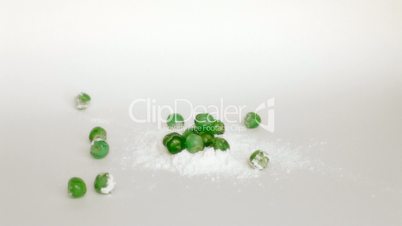 Green candied cherries syrup on icing sugar