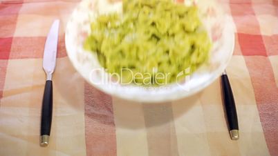 Italian pasta with pesto on table