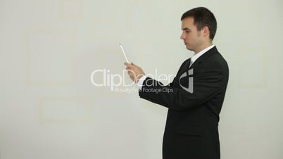 Businessman taking photo with digital tablet